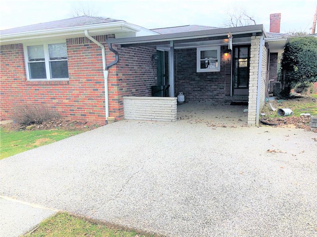 339 Bethel Road North Huntingdon, PA 15642 - Photo 22 of 25 STONE COVERED PATIO ABUTS THE COVERED ROOF