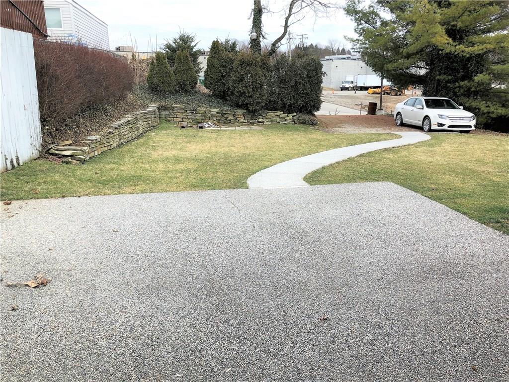 339 Bethel Road North Huntingdon, PA 15642 - Photo 23 of 25 LOOKING FROM STONE PATIO TO PARKING AREA IN THE REAR OF THE HOME.
