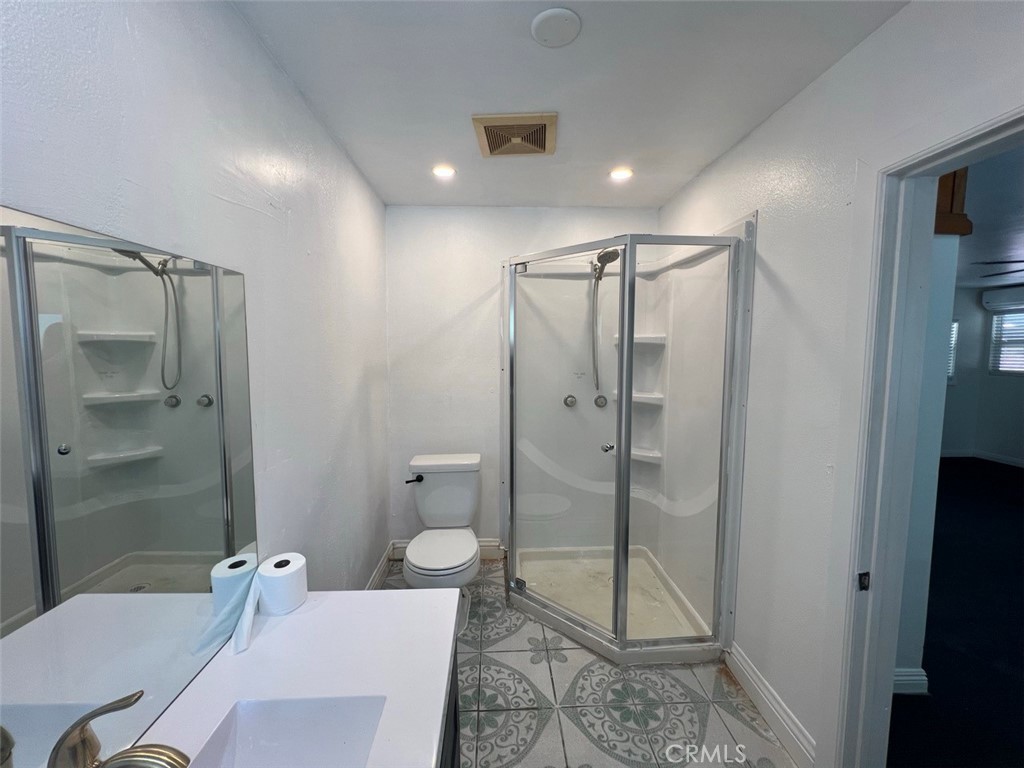 1100 1/2 Winthrop Drive Alhambra, CA 91803 - Photo 6 of 10 a bathroom with a shower a toilet and sink