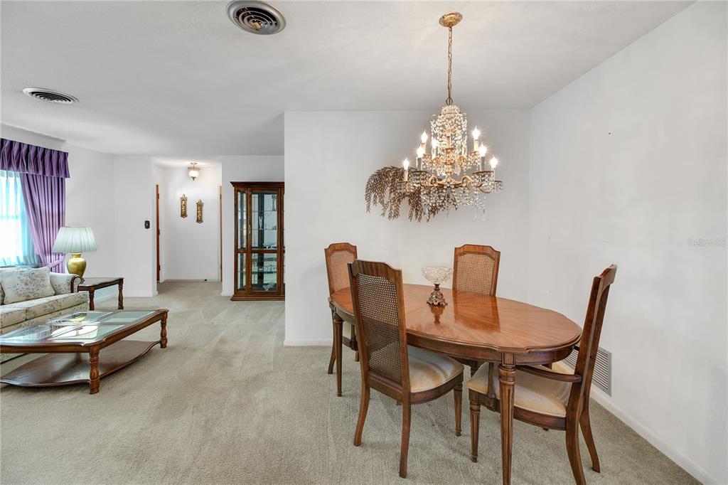 2214 Topping Place Eustis, FL 32726 - Photo 12 of 57 a dining room with furniture and window