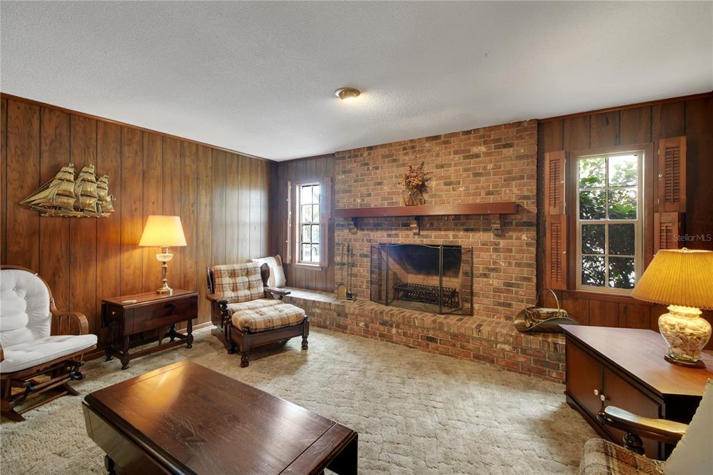 2214 Topping Place Eustis, FL 32726 - Photo 14 of 57 a living room with furniture and a fireplace