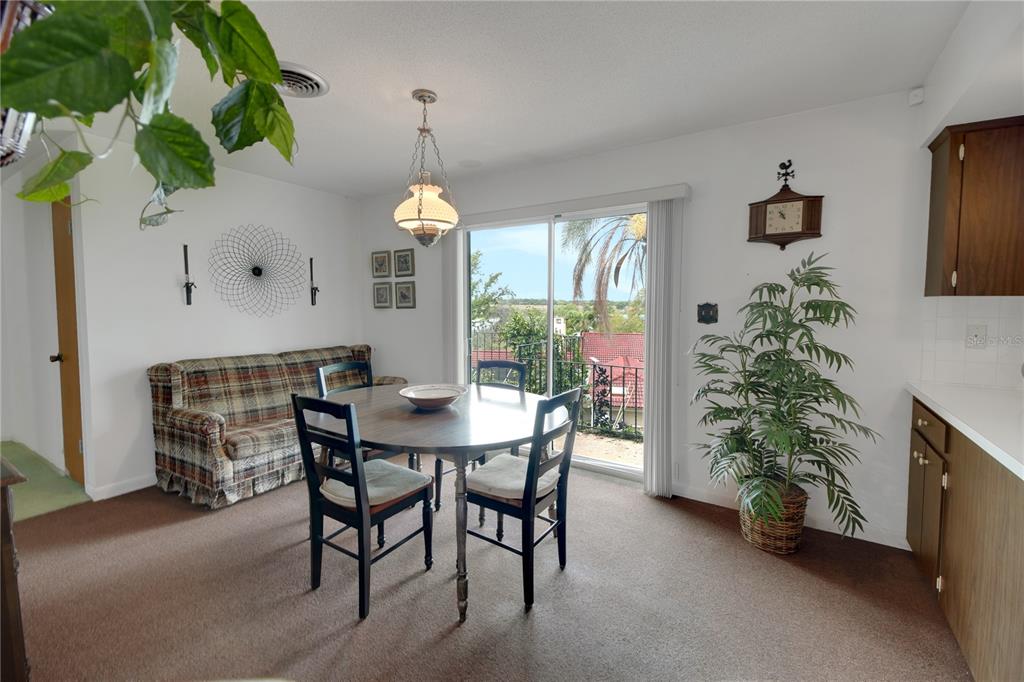2214 Topping Place Eustis, FL 32726 - Photo 24 of 57 a dining room with furniture and window