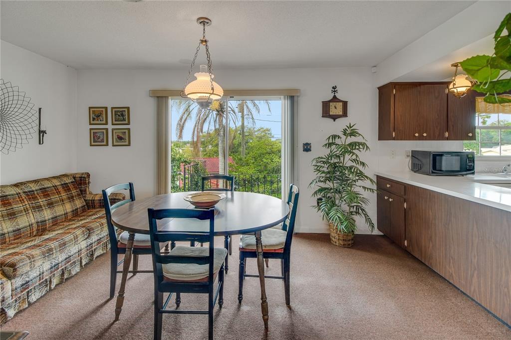 2214 Topping Place Eustis, FL 32726 - Photo 25 of 57 a dining room with furniture and window