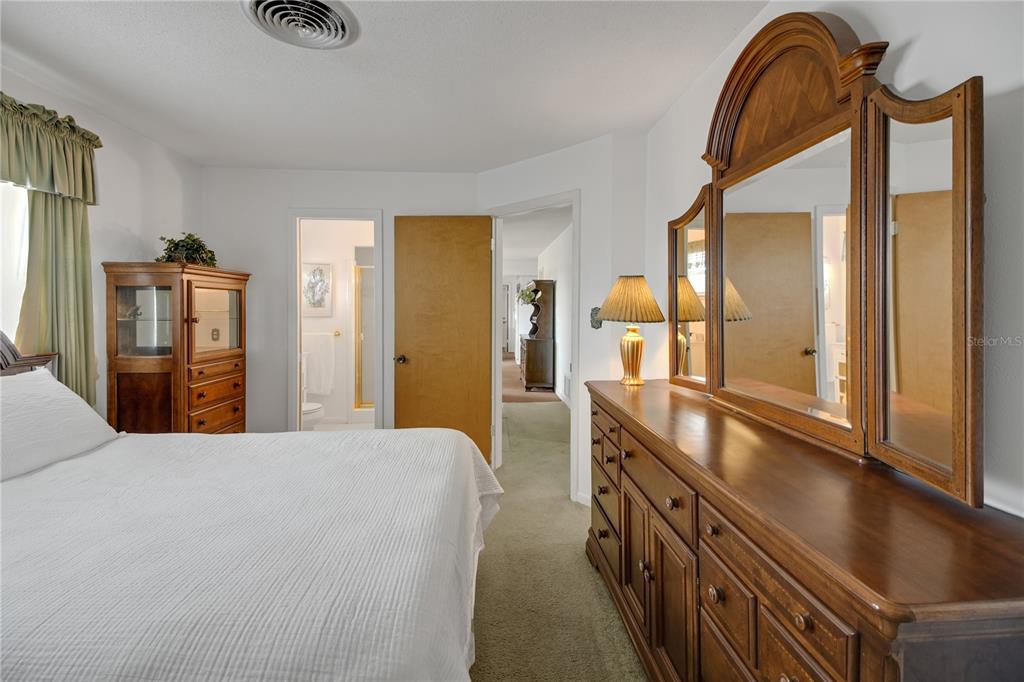 2214 Topping Place Eustis, FL 32726 - Photo 27 of 57 a spacious bathroom with a double vanity sink and a mirror