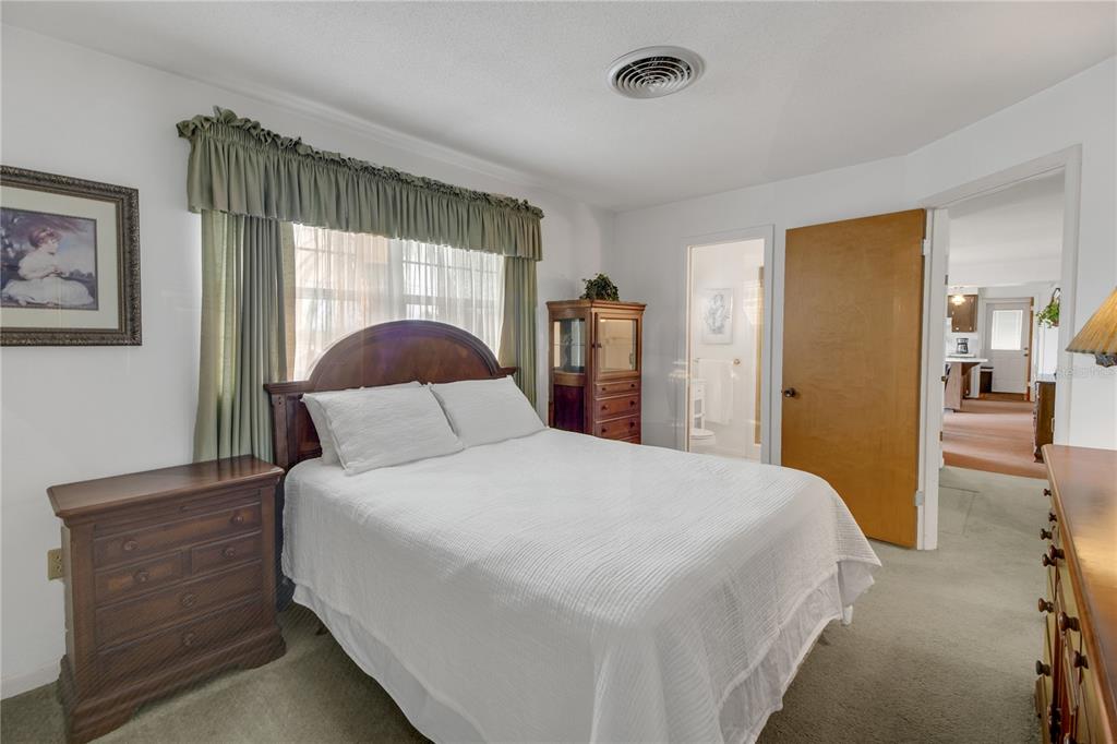 2214 Topping Place Eustis, FL 32726 - Photo 28 of 57 a bedroom with a bed and a window