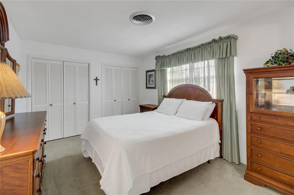 2214 Topping Place Eustis, FL 32726 - Photo 29 of 57 a bedroom with a bed and a window