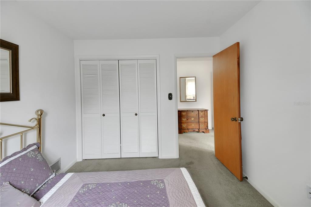 2214 Topping Place Eustis, FL 32726 - Photo 33 of 57 a view of a hallway with wooden floor and a living room