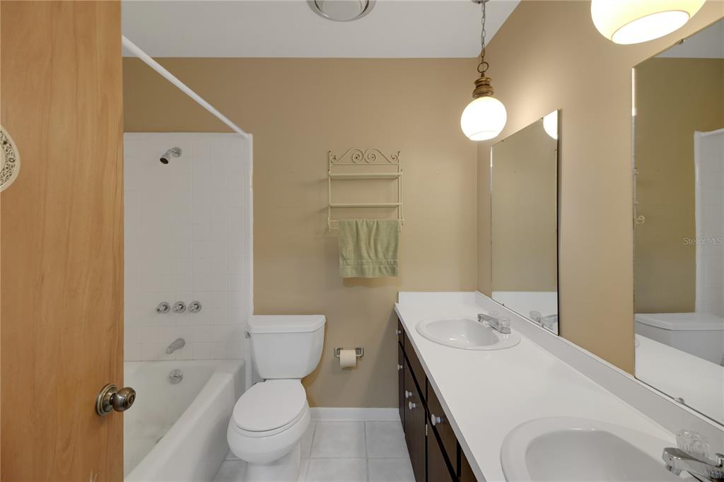 2214 Topping Place Eustis, FL 32726 - Photo 35 of 57 a bathroom with a sink a toilet and shower