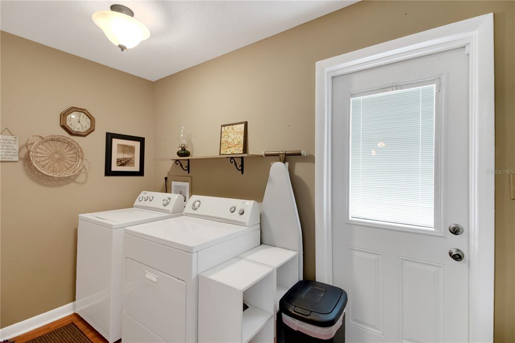 2214 Topping Place Eustis, FL 32726 - Photo 38 of 57 a bathroom with a toilet and a mirror