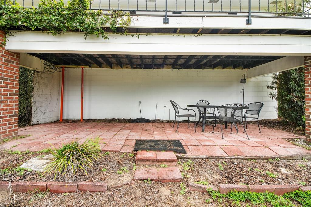 2214 Topping Place Eustis, FL 32726 - Photo 40 of 57 a view of swimming pool with outdoor seating and plants