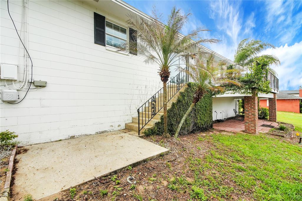 2214 Topping Place Eustis, FL 32726 - Photo 41 of 57 a view of a house with a patio