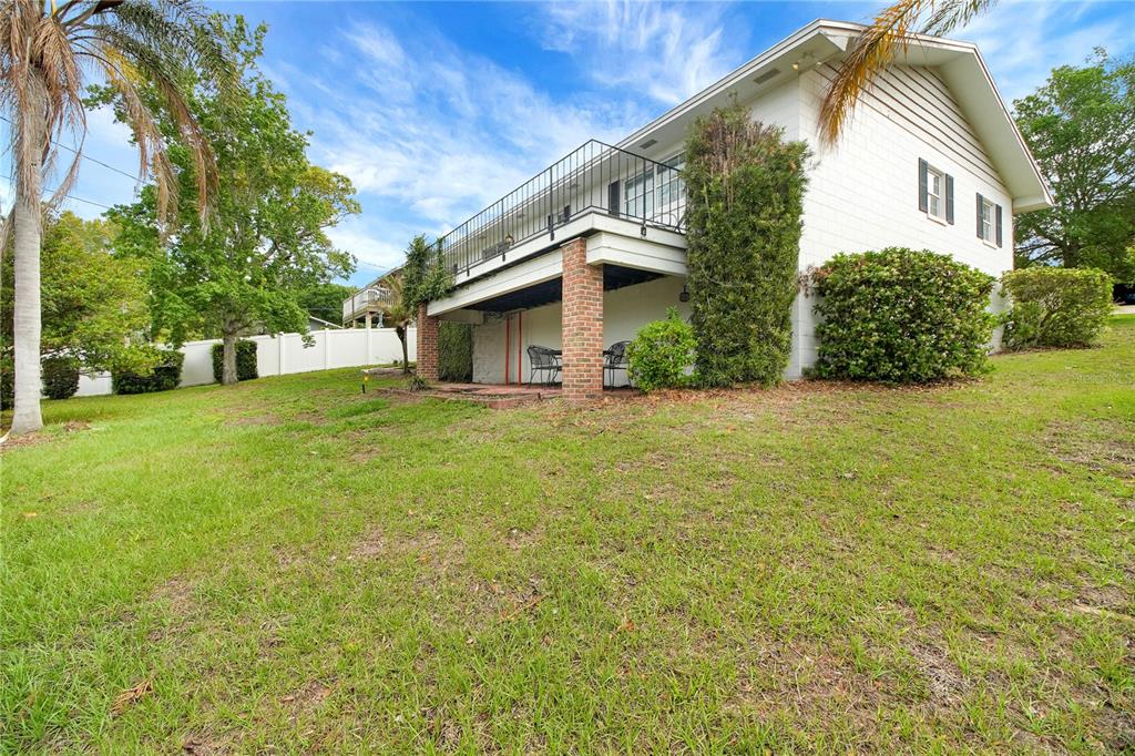 2214 Topping Place Eustis, FL 32726 - Photo 44 of 57 a view of a house with a yard