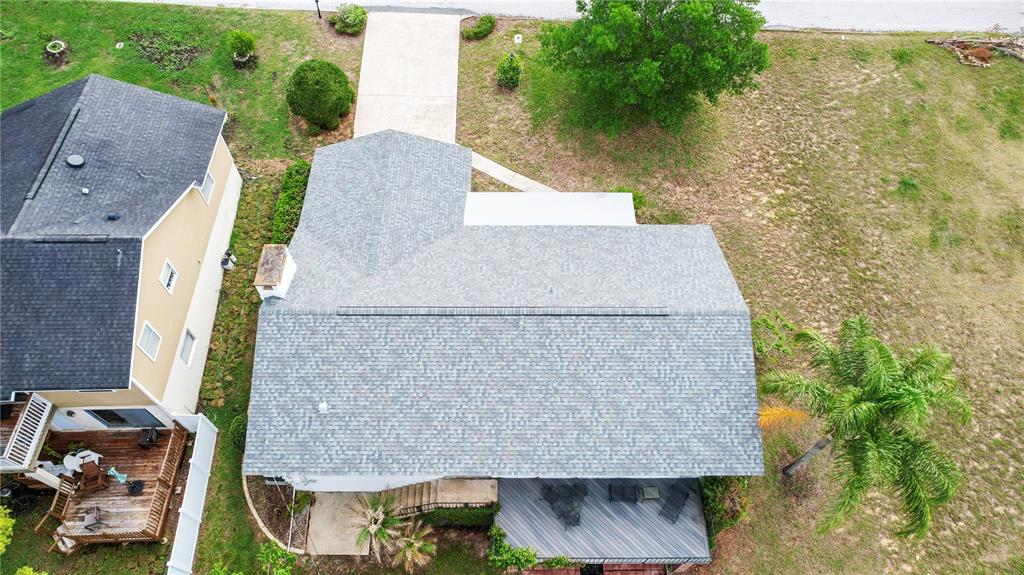 2214 Topping Place Eustis, FL 32726 - Photo 46 of 57 an aerial view of a house with swimming pool and large trees