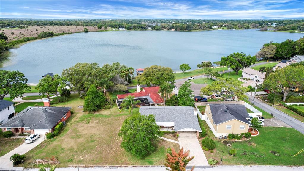 2214 Topping Place Eustis, FL 32726 - Photo 47 of 57 an aerial view of a house with a lake view