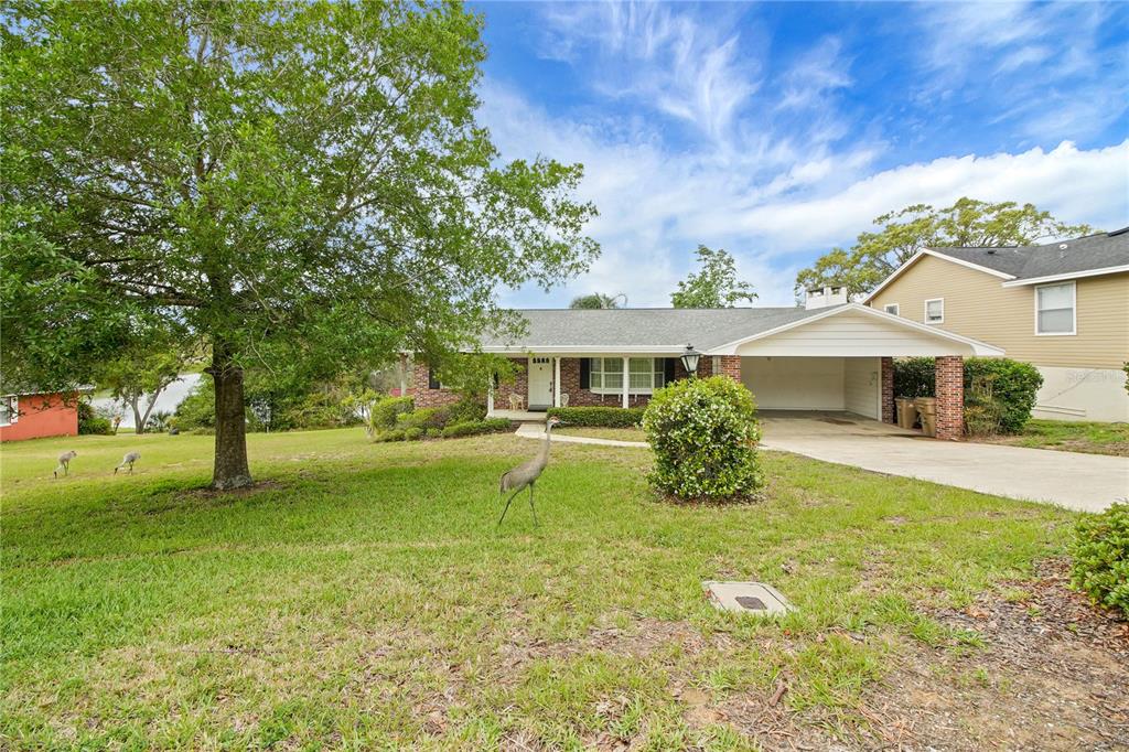 2214 Topping Place Eustis, FL 32726 - Photo 51 of 57 a view of a house with a yard