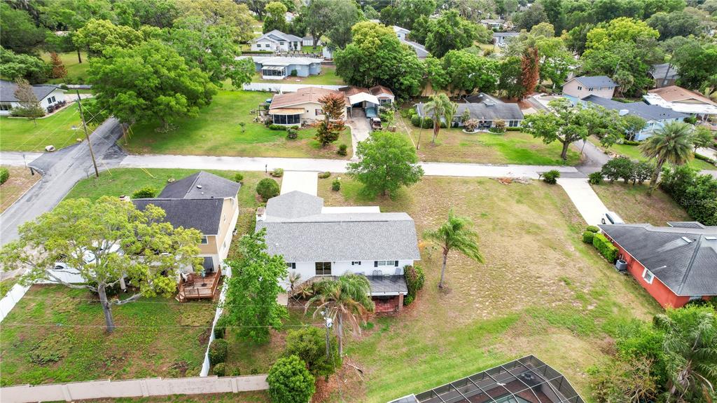 2214 Topping Place Eustis, FL 32726 - Photo 55 of 57 an aerial view of a house with a garden