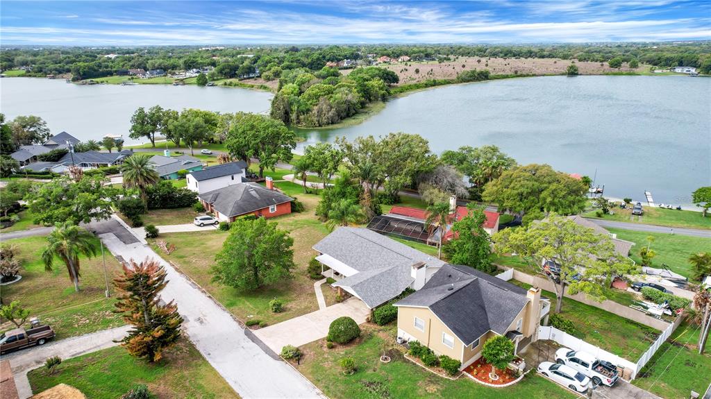 2214 Topping Place Eustis, FL 32726 - Photo 56 of 57 an aerial view of a house with a lake view
