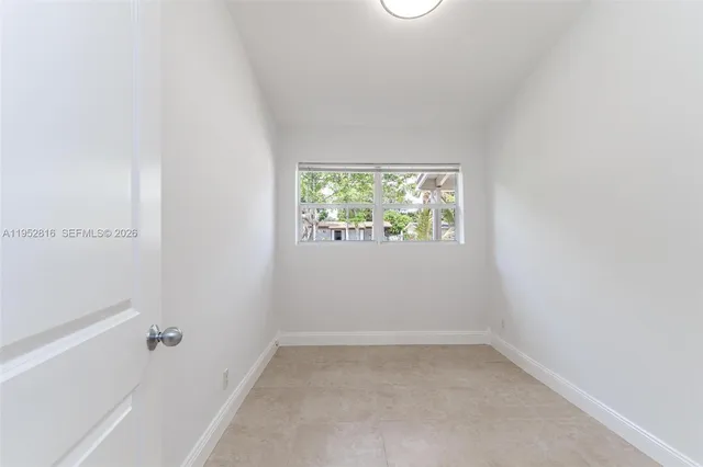 a view of a house with backyard sitting area and garden