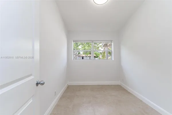 a view of a house with backyard sitting area and garden