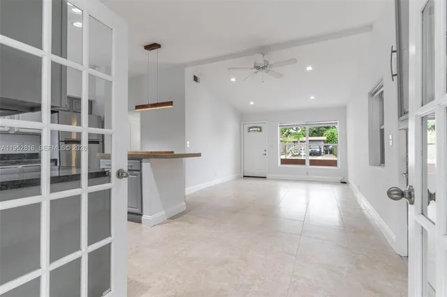 a view of an empty room with a window