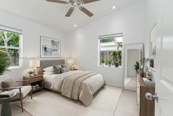 a bedroom with a bed furniture and a window