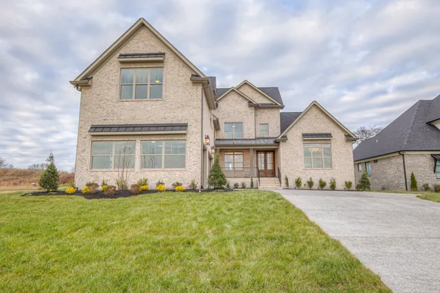 a view of a chandelier in big room and wooden floor
