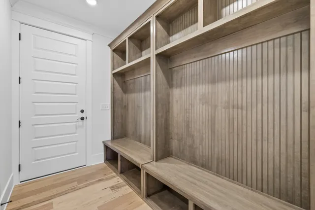 a bathroom with a glass shower door and a bathtub