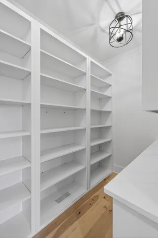 a white toilet sitting next to a bathroom sink