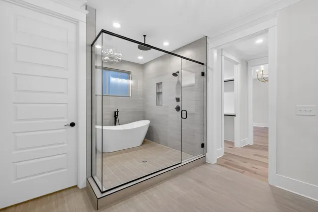 a front view of a house with a garden and yard