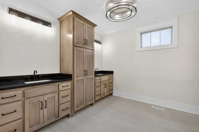 a view of a lake with houses in the background