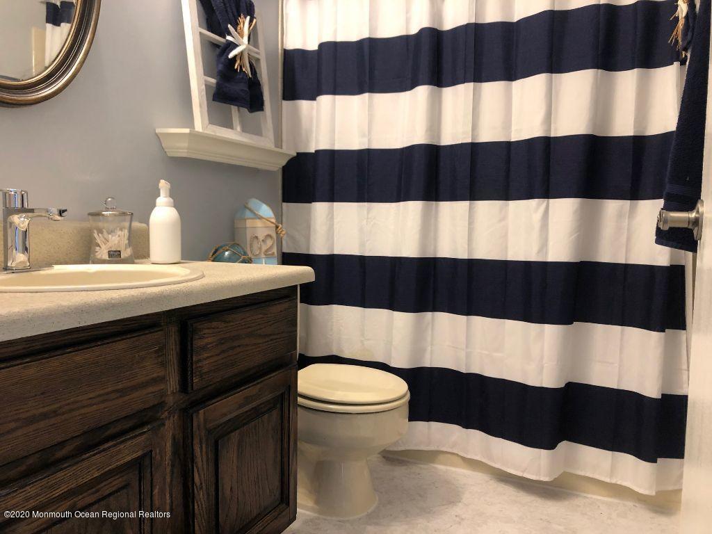 4 Alpine Road Whiting, NJ 08759 - Photo 16 of 37 a bathroom with a sink and a mirror