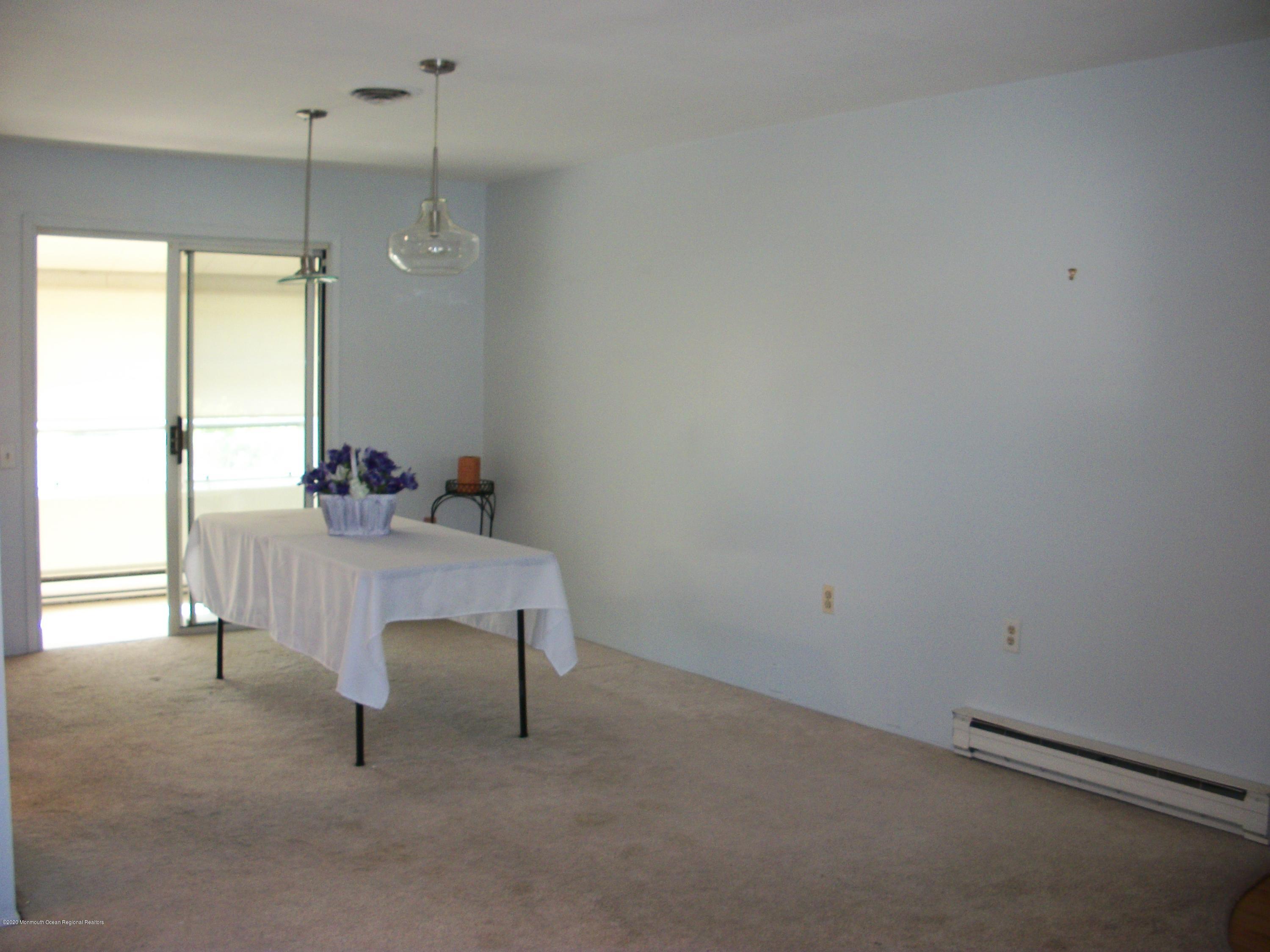 4 Alpine Road Whiting, NJ 08759 - Photo 20 of 37 a room with a table and a chair