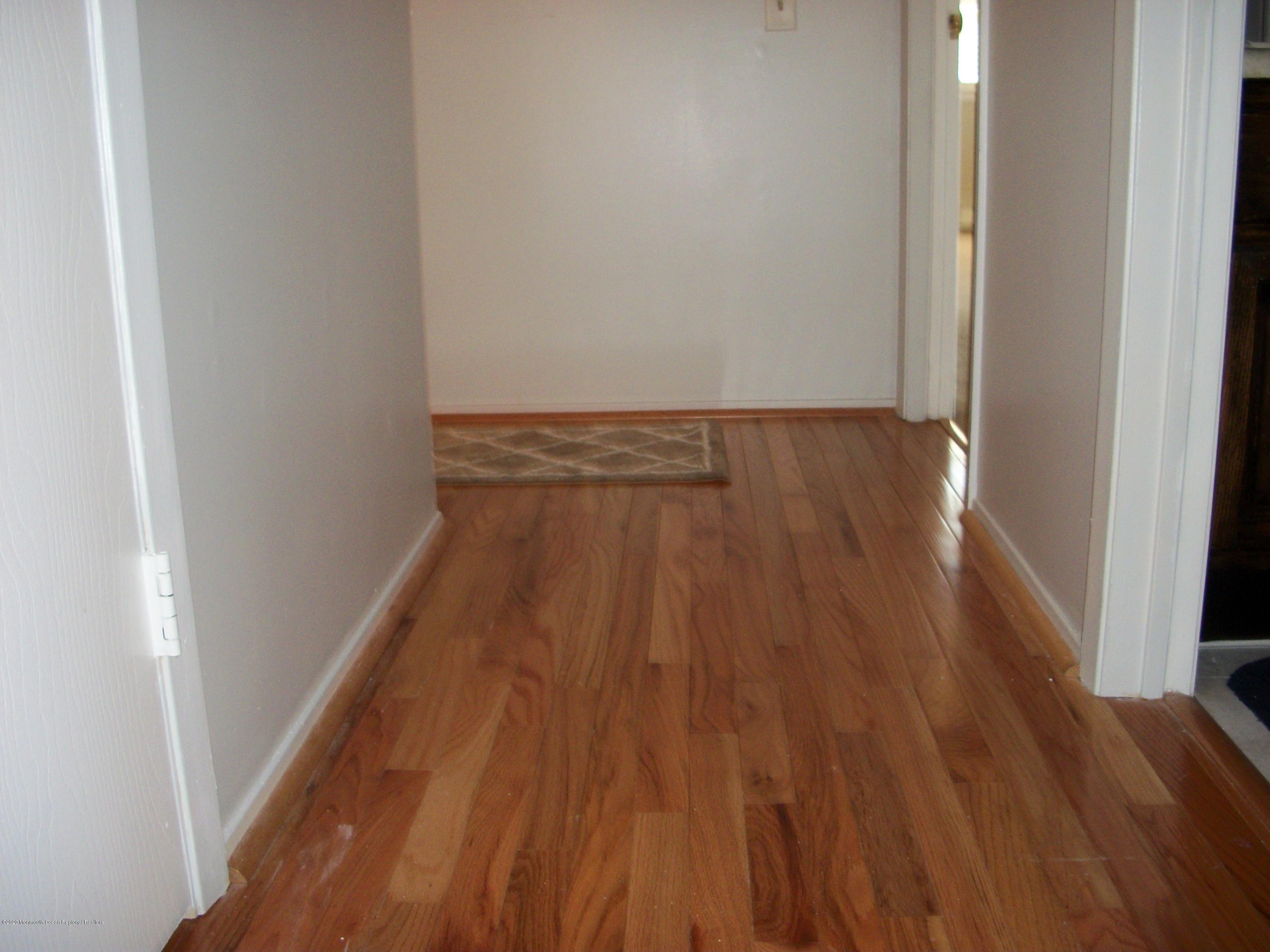4 Alpine Road Whiting, NJ 08759 - Photo 22 of 37 a view of a hallway with wooden floor