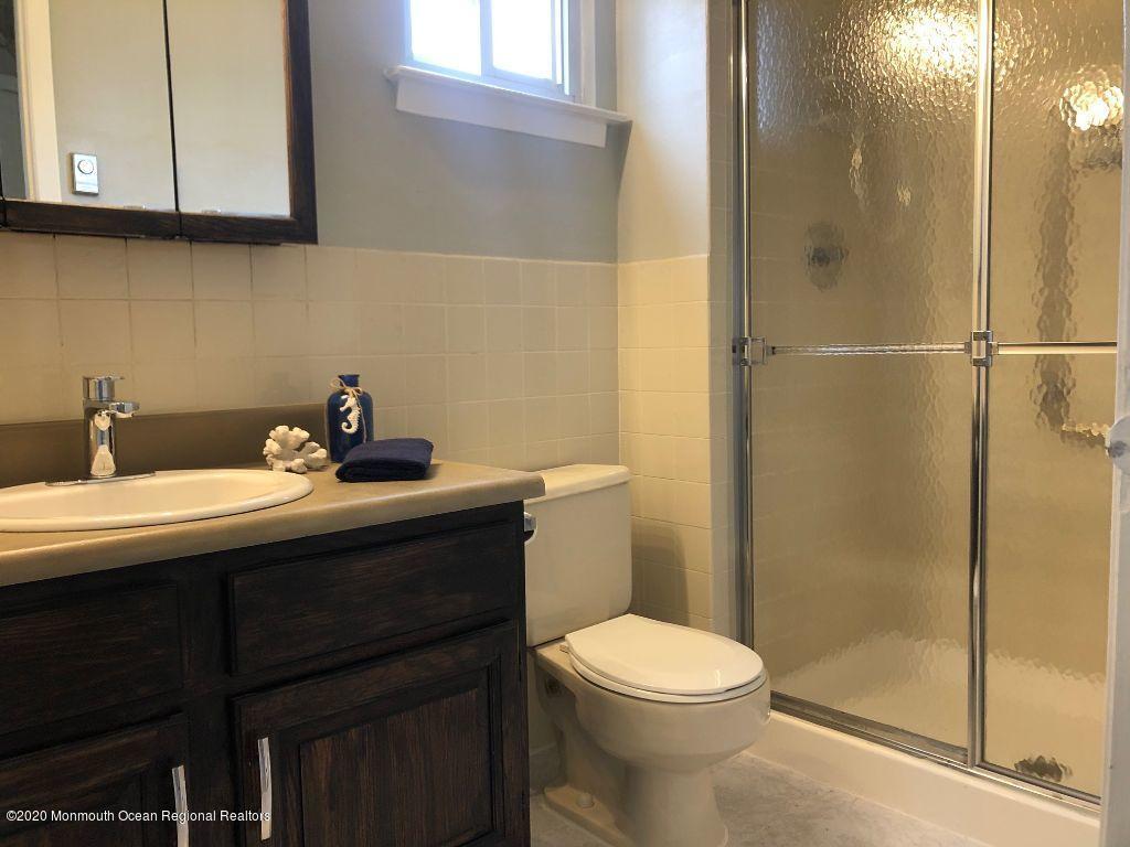 4 Alpine Road Whiting, NJ 08759 - Photo 28 of 37 a bathroom with a sink a toilet and shower