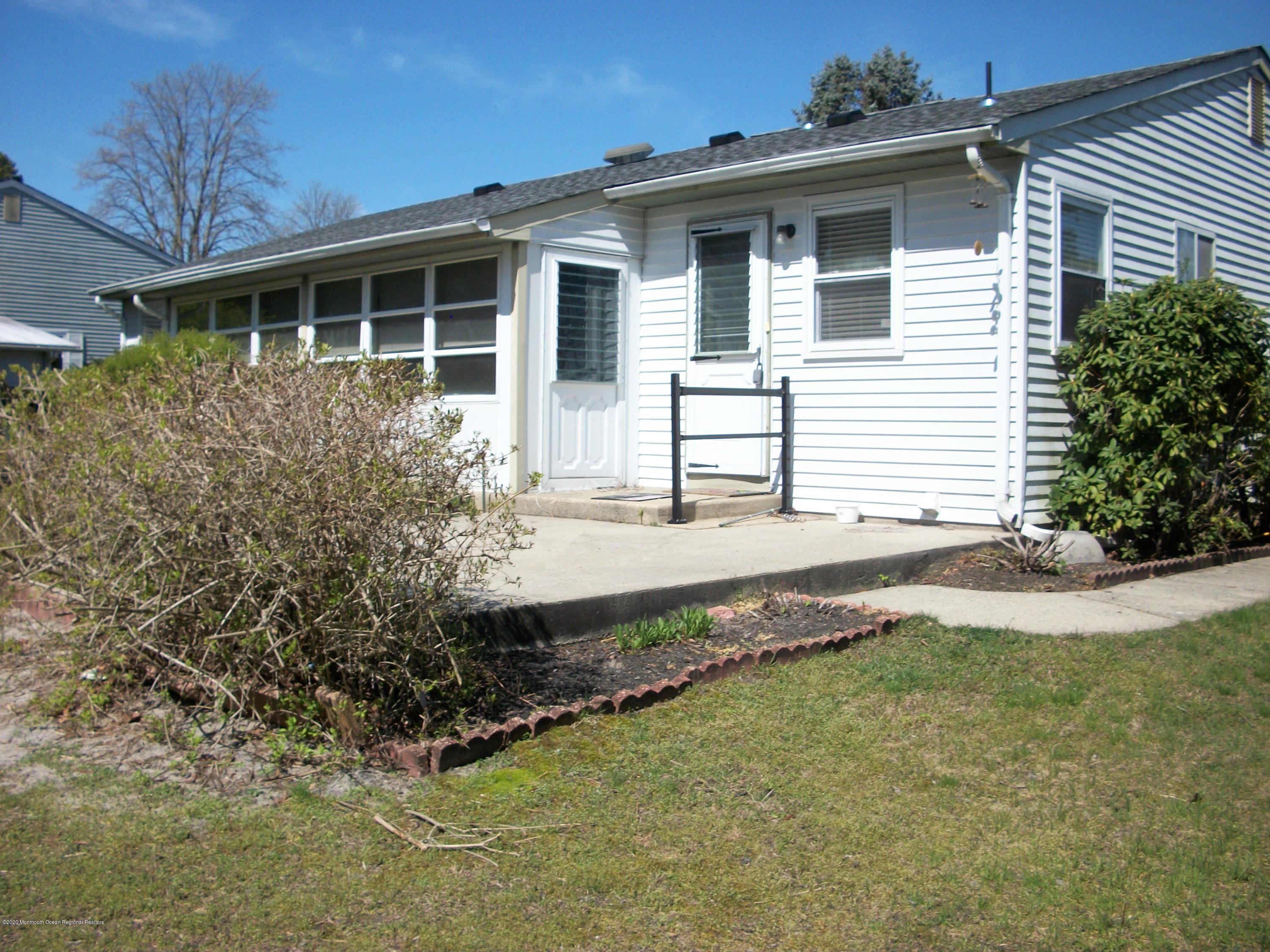 4 Alpine Road Whiting, NJ 08759 - Photo 33 of 37 a front view of a house with garden