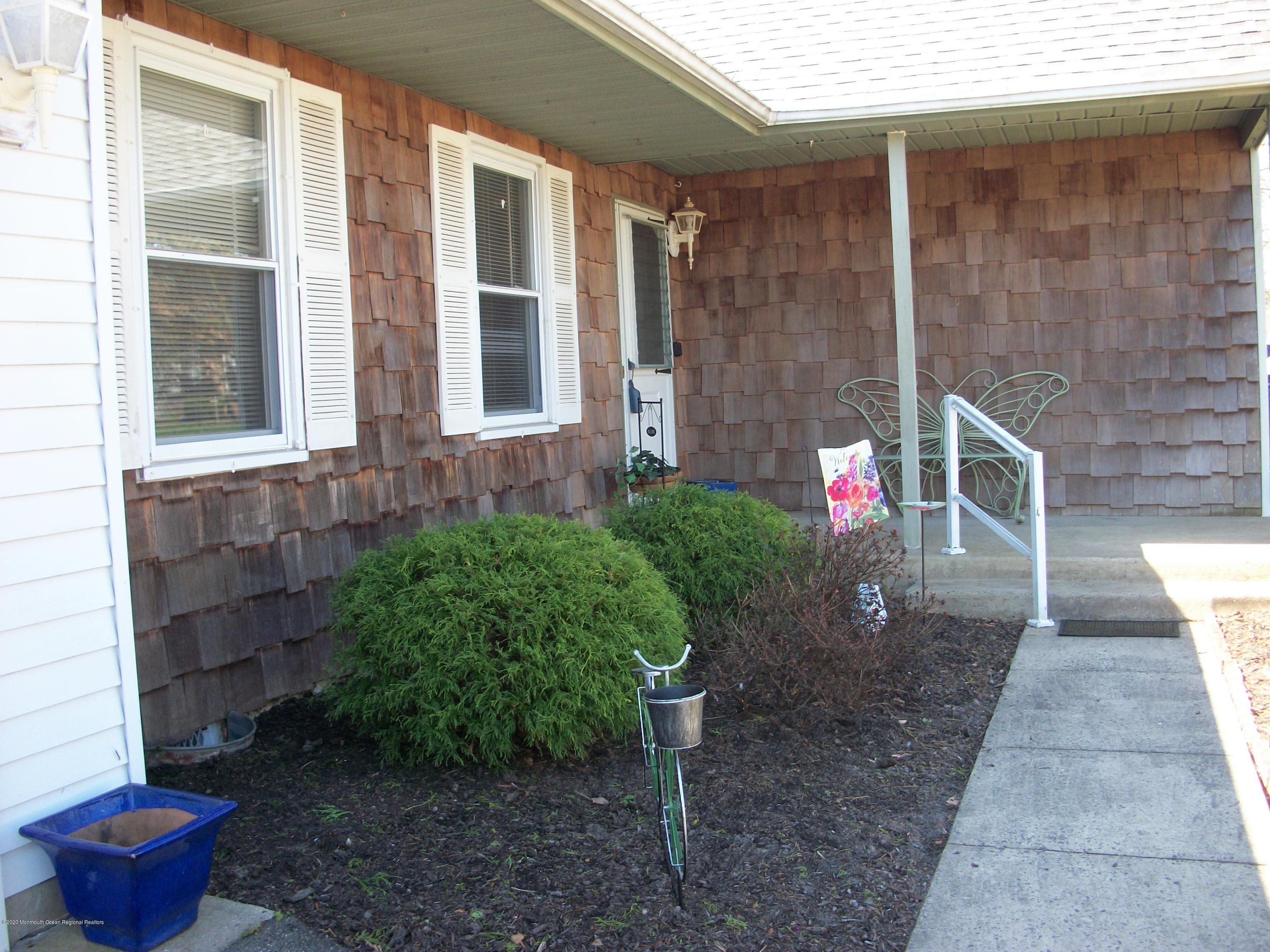 4 Alpine Road Whiting, NJ 08759 - Photo 8 of 37 a view of a backyard with potted plants