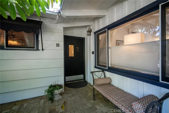 a bench sitting in front of a door