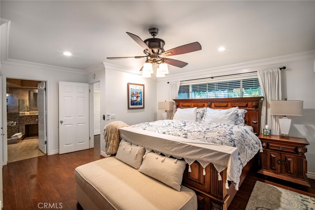 33915 Robles Drive, Unit A Dana Point, CA 92629 - Photo 13 of 37 a bedroom with a bed and dresser with wooden floor