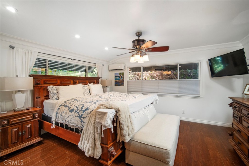 33915 Robles Drive, Unit A Dana Point, CA 92629 - Photo 14 of 37 a bedroom with a bed and a flat screen tv