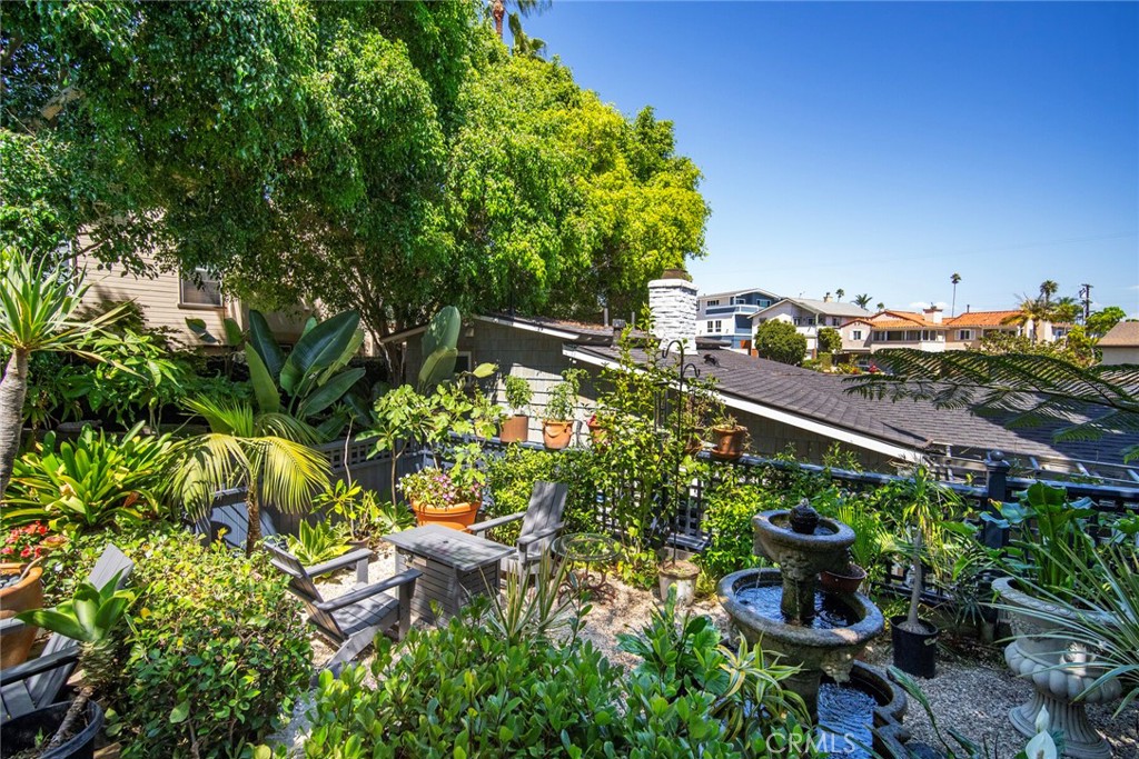 33915 Robles Drive, Unit A Dana Point, CA 92629 - Photo 34 of 37 a backyard of a house with lots of green space