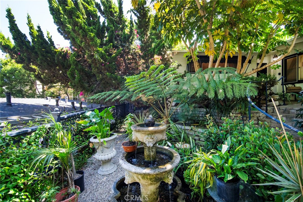 33915 Robles Drive, Unit A Dana Point, CA 92629 - Photo 36 of 37 a view of a chair and table in a garden