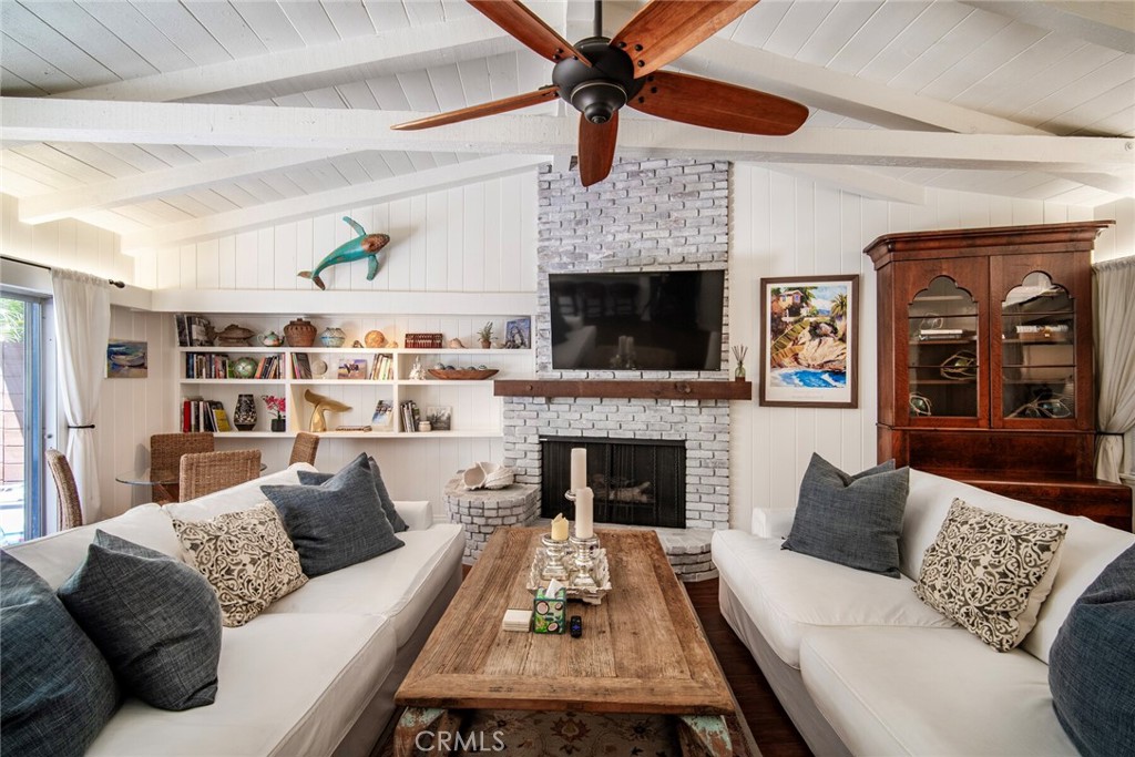 33915 Robles Drive, Unit A Dana Point, CA 92629 - Photo 6 of 37 a living room with furniture and a fireplace