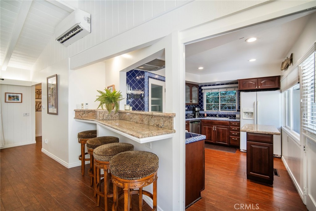 33915 Robles Drive, Unit A Dana Point, CA 92629 - Photo 9 of 37 a living room with furniture and a wooden floor