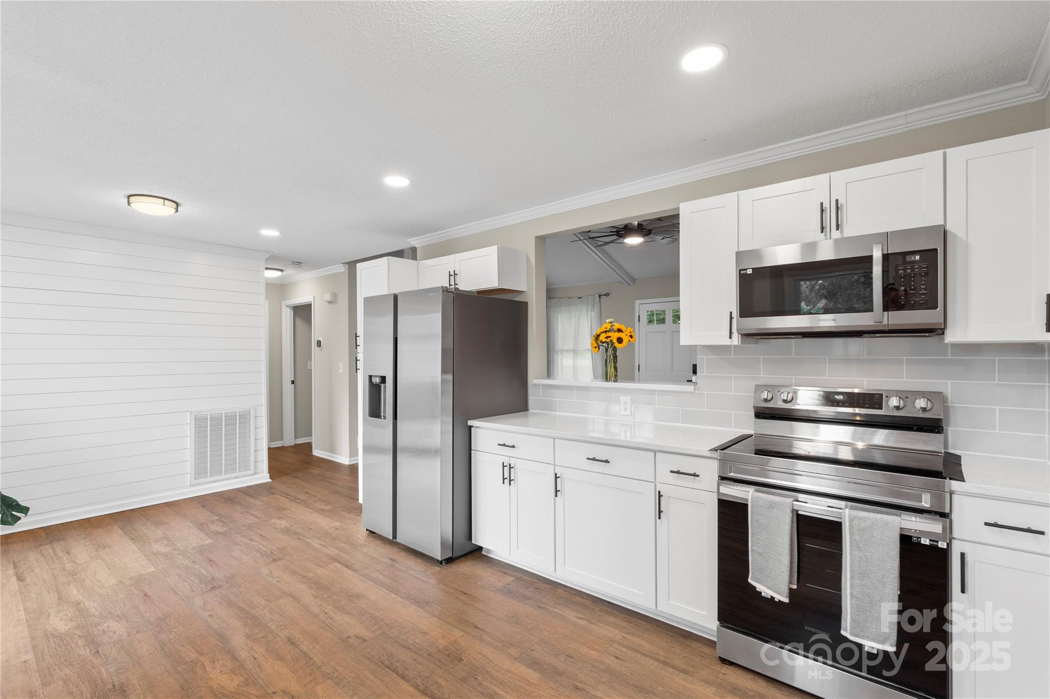 2302 Old Hickory Grove Road Mount Holly, NC 28120 - Photo 18 of 48 a kitchen with stainless steel appliances a stove microwave and refrigerator