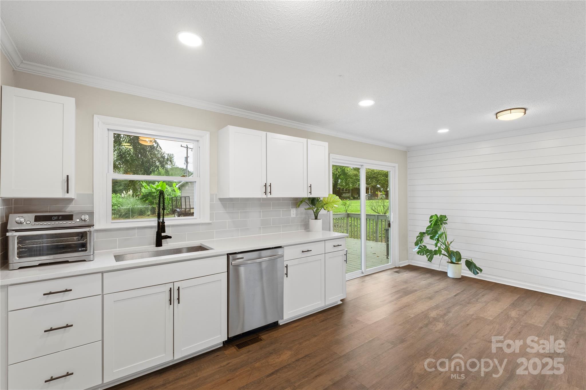 2302 Old Hickory Grove Road Mount Holly, NC 28120 - Photo 19 of 48 a kitchen with a white stove top oven sink and cabinets