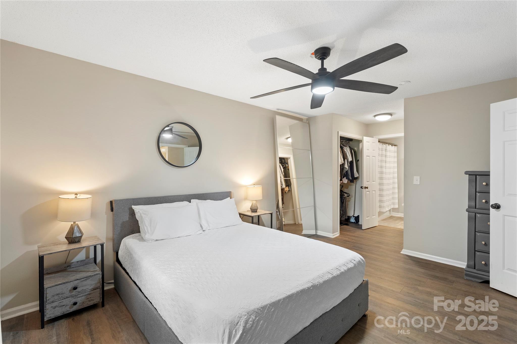 2302 Old Hickory Grove Road Mount Holly, NC 28120 - Photo 23 of 48 a bedroom with a bed and a chandelier