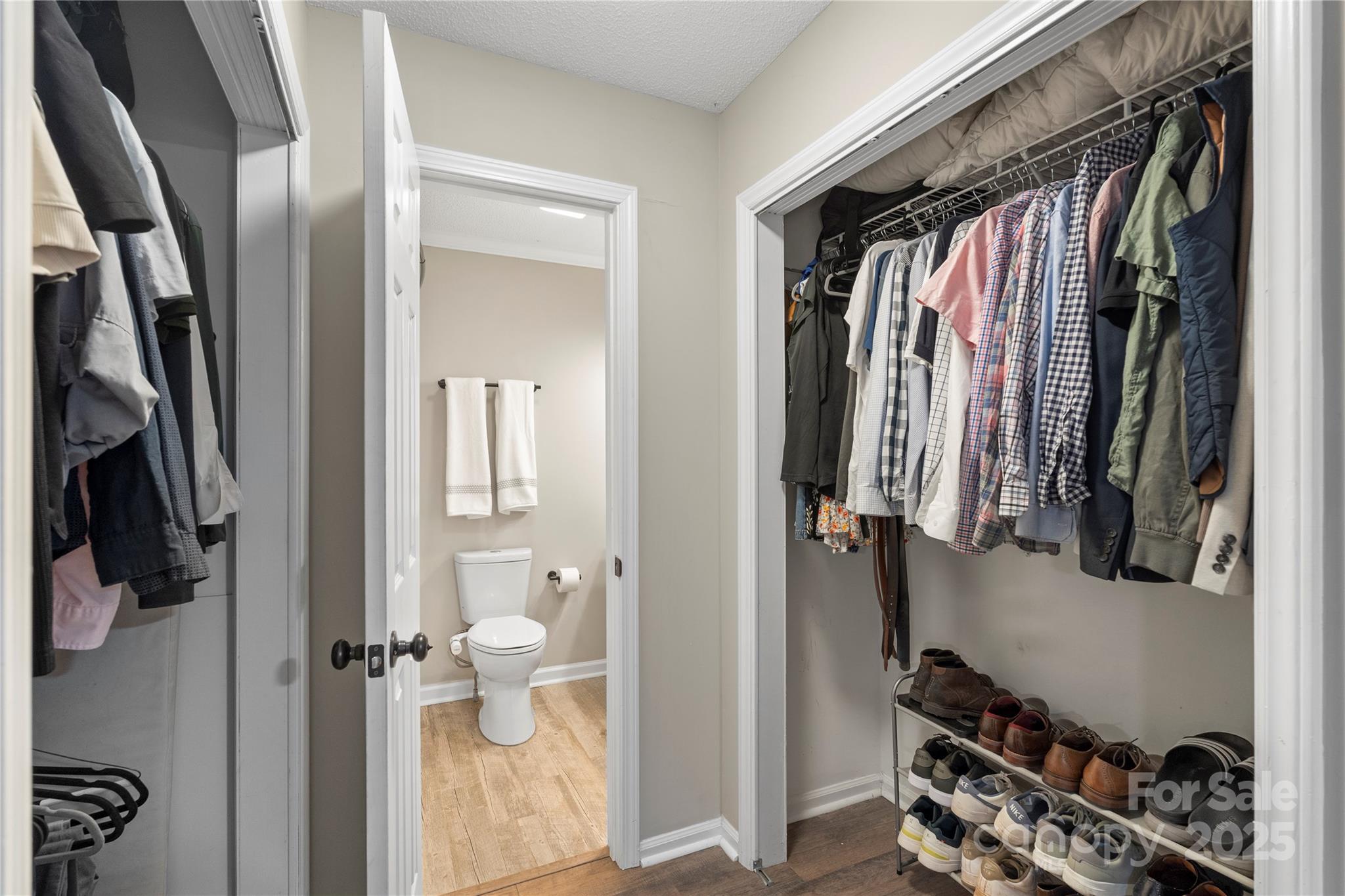 2302 Old Hickory Grove Road Mount Holly, NC 28120 - Photo 25 of 48 a view of walk in closet with clothes and shoes
