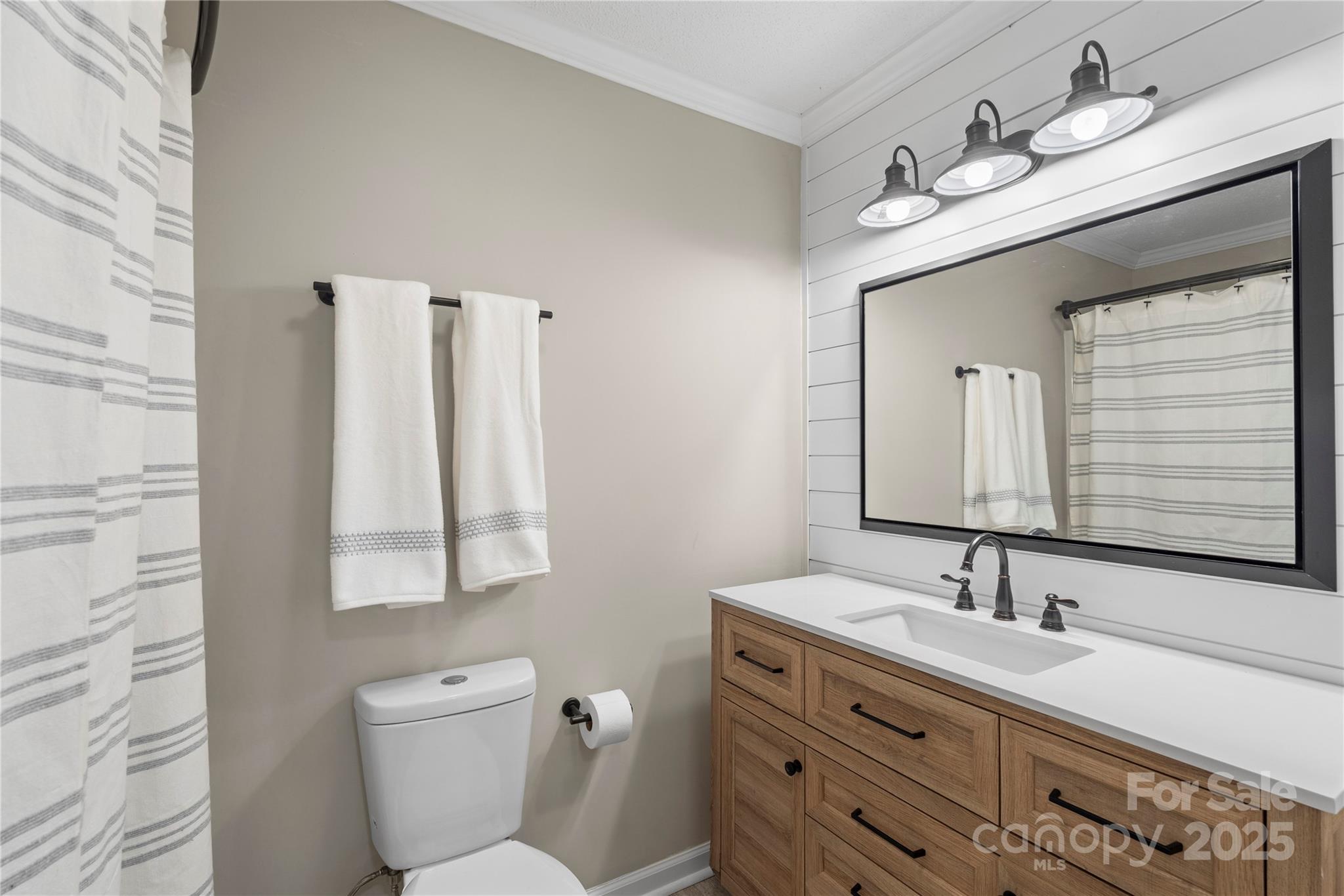 2302 Old Hickory Grove Road Mount Holly, NC 28120 - Photo 27 of 48 a bathroom with a double vanity sink and a mirror