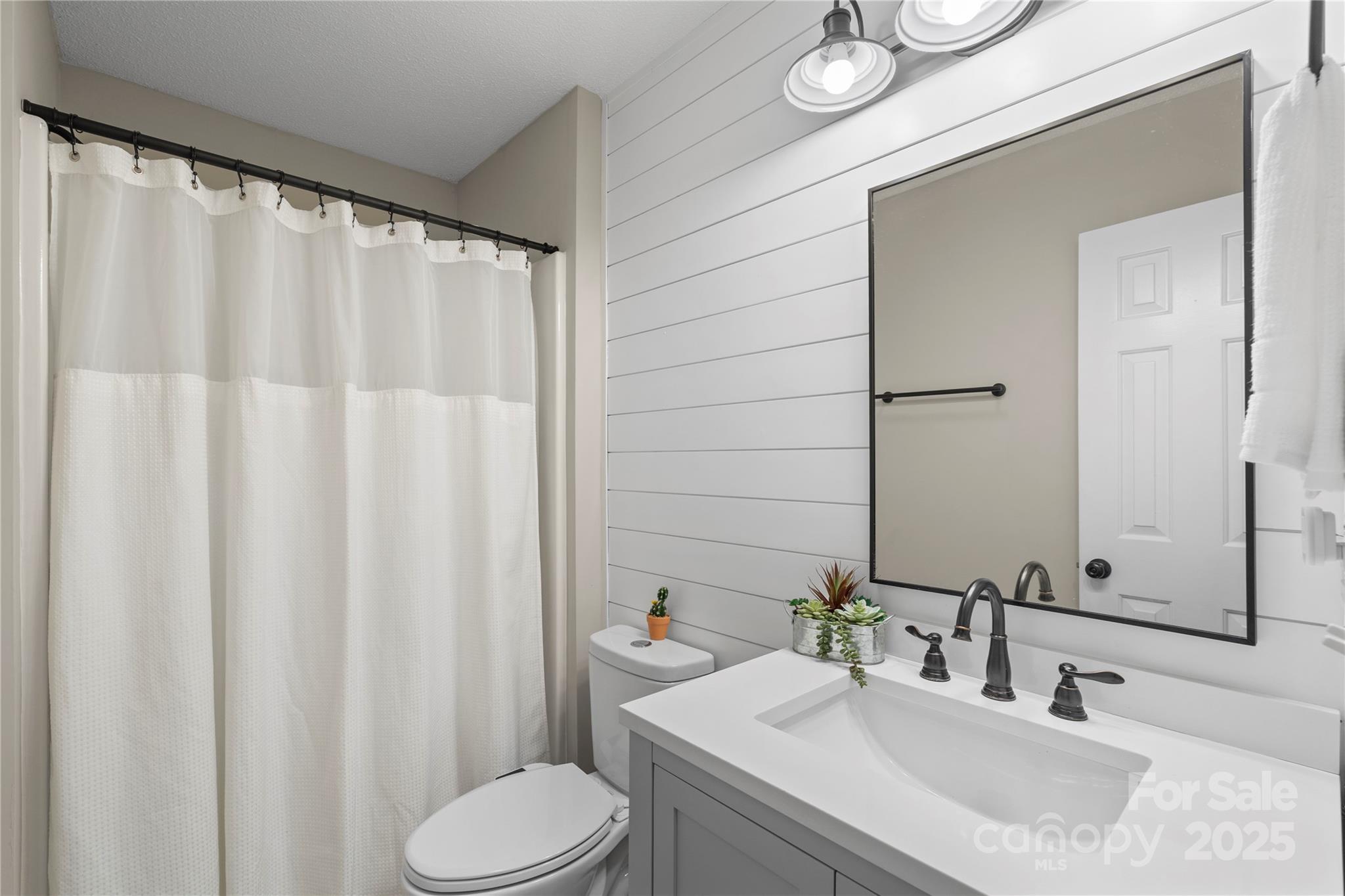 2302 Old Hickory Grove Road Mount Holly, NC 28120 - Photo 33 of 48 a bathroom with a sink and a mirror