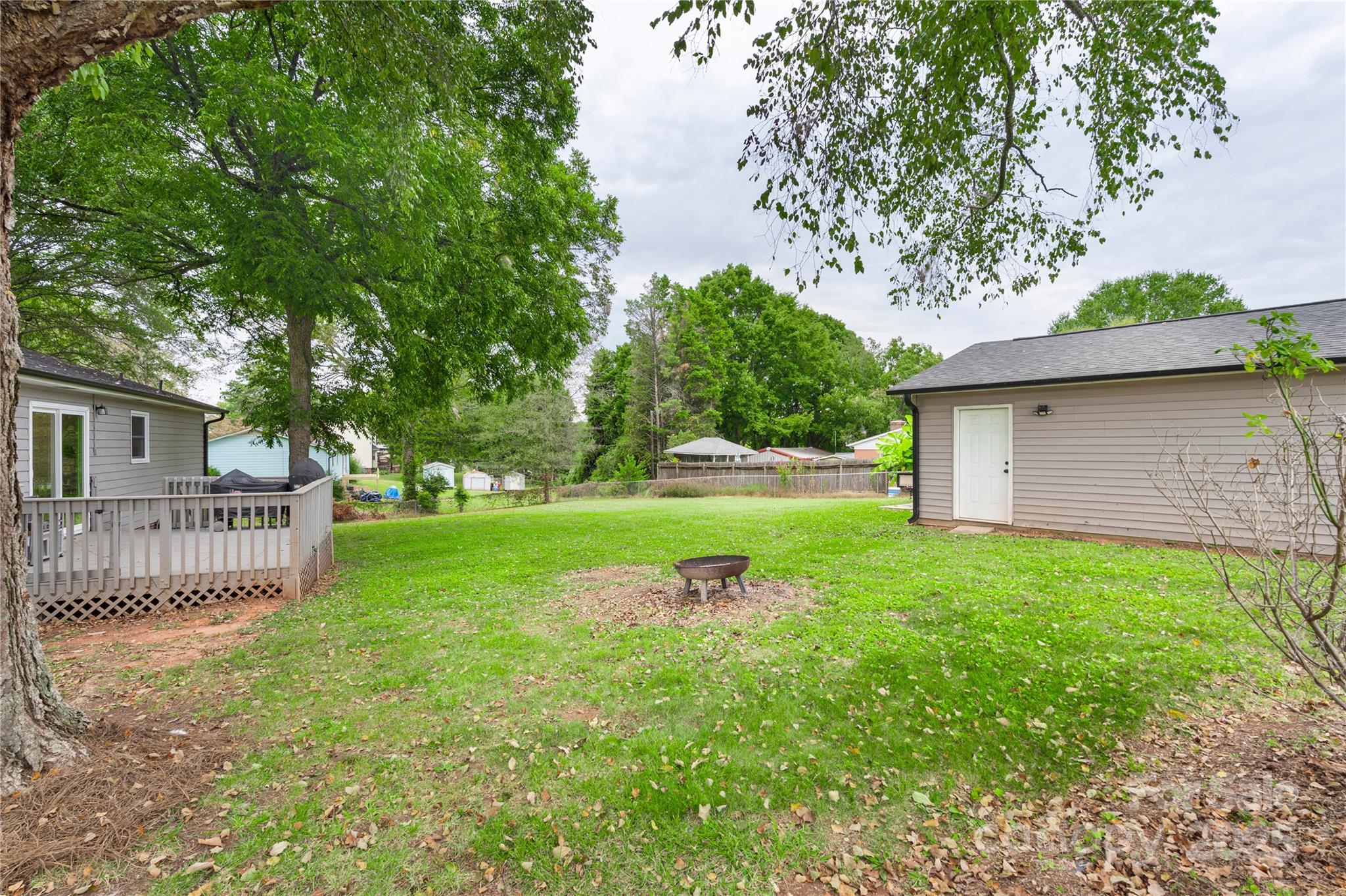 2302 Old Hickory Grove Road Mount Holly, NC 28120 - Photo 39 of 48 a view of a house with a yard and a garden